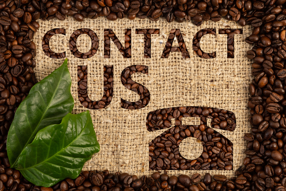 contact,us,concept,with,phone,symbol,written,by,using,coffee